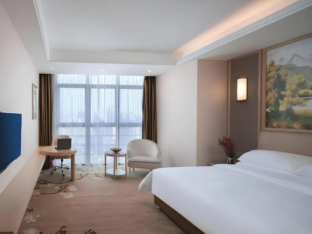 Bed in Vienna Hotel Fujian Fuqing Wanda Plaza