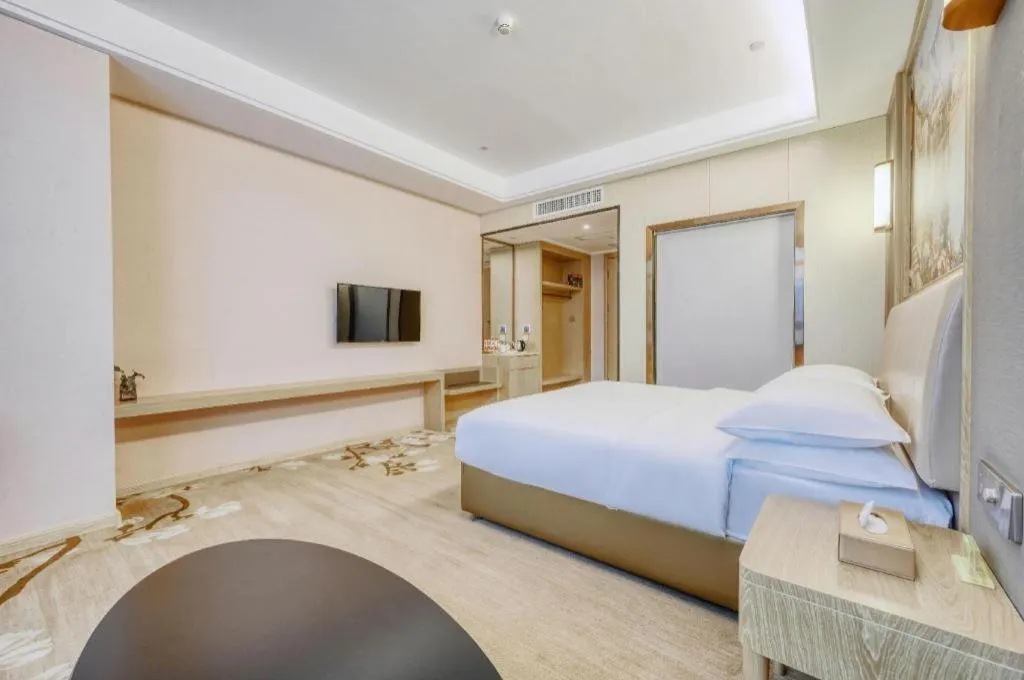 Bed in Vienna Hotel Fujian Fuqing Wanda Plaza