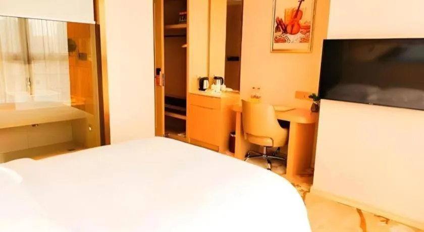 Bed in Vienna Hotel Fujian Fuqing Wanda Plaza