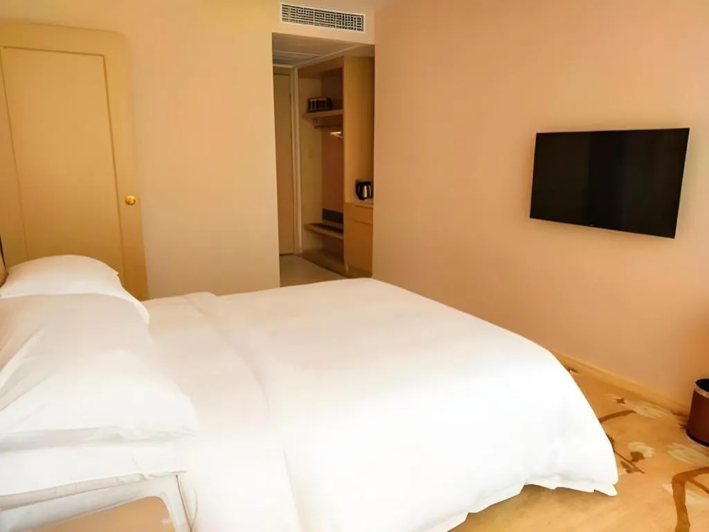 Bed in Vienna Hotel Fujian Fuqing Wanda Plaza