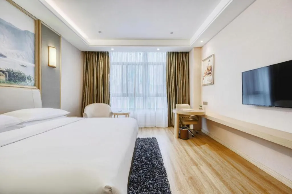 Bed in Vienna Hotel Fujian Fuqing Wanda Plaza