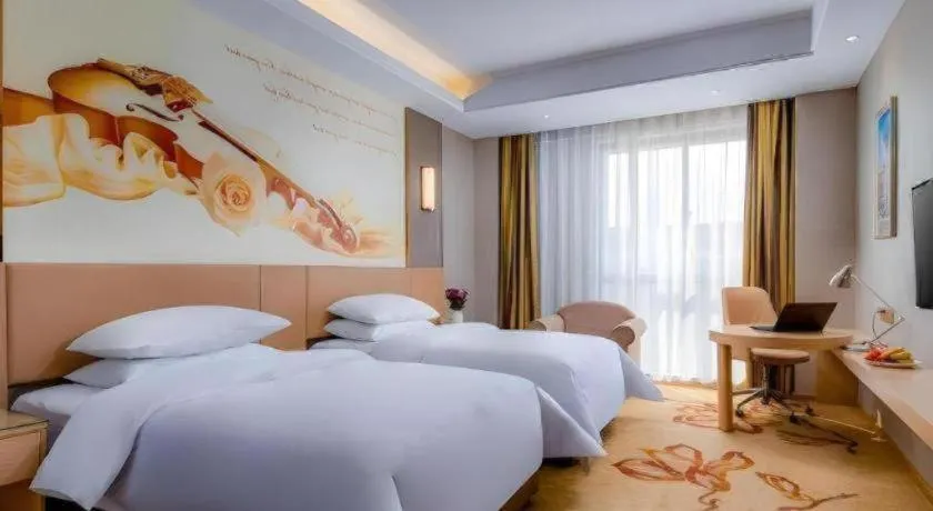 Bed in Vienna Hotel Anhui Fuyang Funan Bailing Apartment