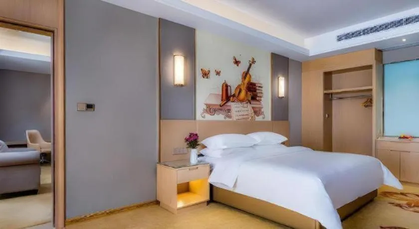 Bed in Vienna Hotel Anhui Fuyang Funan Bailing Apartment
