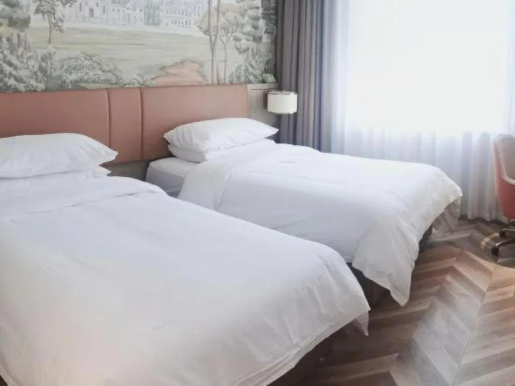 Bed in Vienna Hotel Jinan Beiyuan Street Red Star Macalline