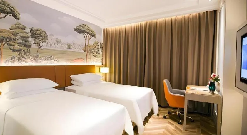 Bed in Vienna Hotel Jinan Beiyuan Street Red Star Macalline