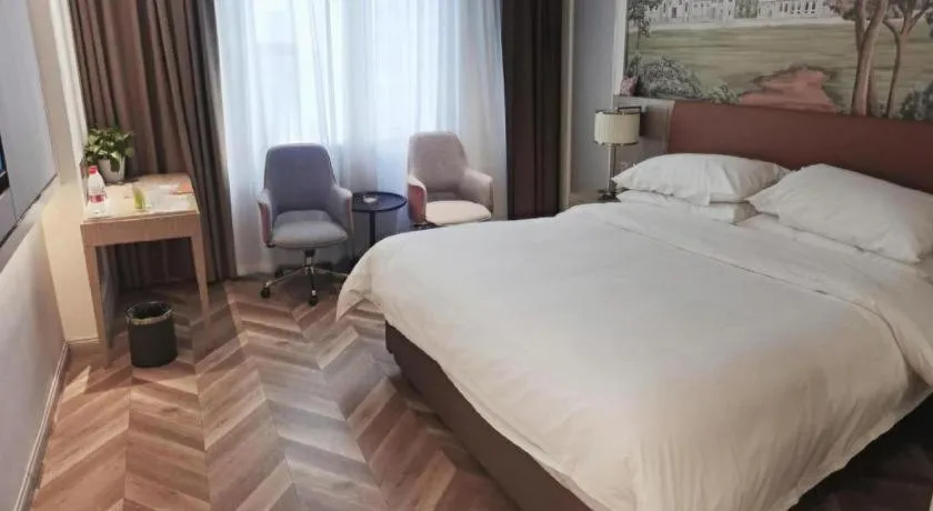 Bed in Vienna Hotel Jinan Beiyuan Street Red Star Macalline