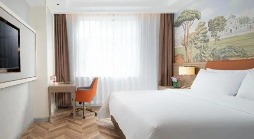Bed in Vienna Hotel Jinan Beiyuan Street Red Star Macalline