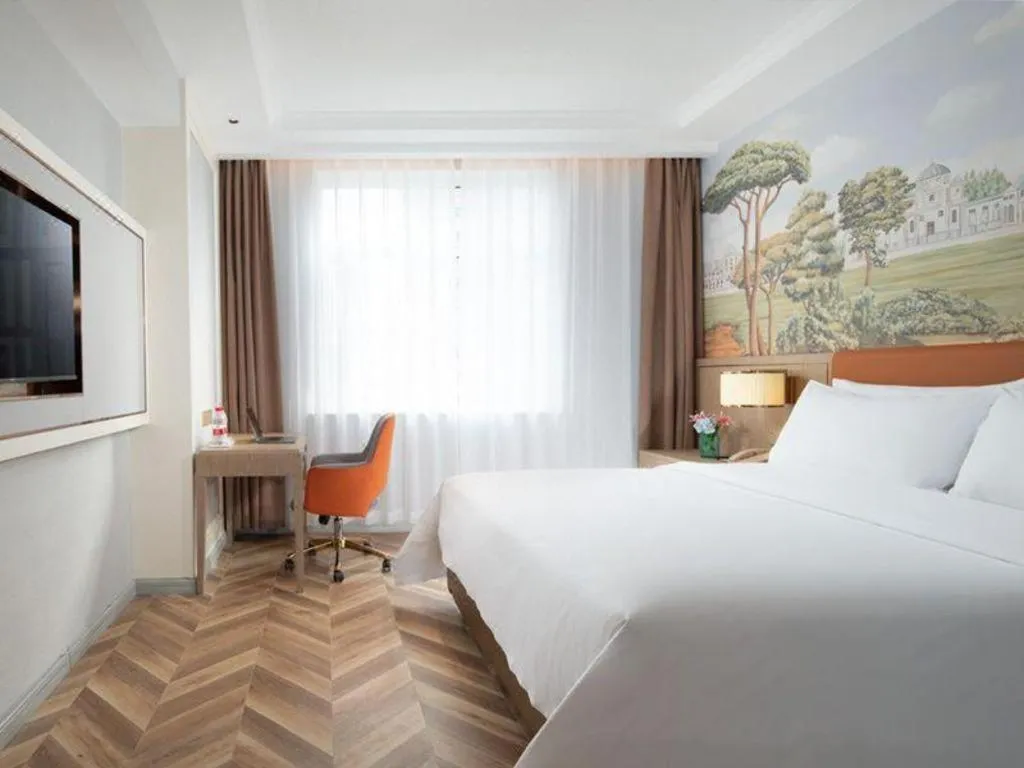 Bed in Vienna Hotel Jinan Beiyuan Street Red Star Macalline