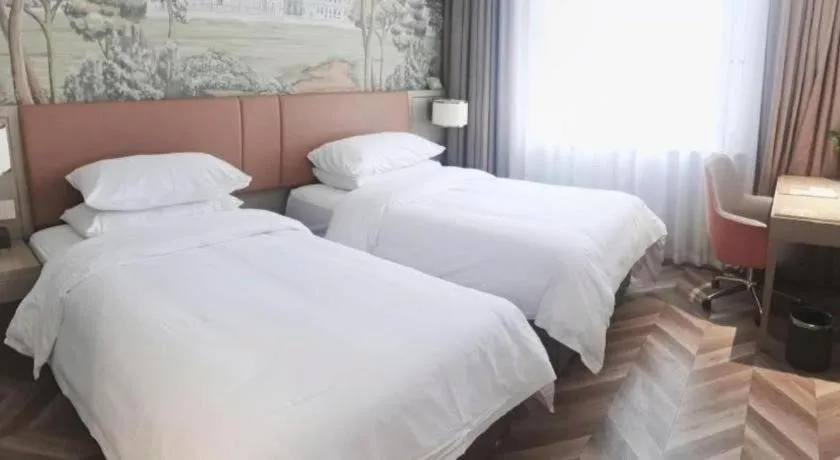 Bed in Vienna Hotel Jinan Beiyuan Street Red Star Macalline