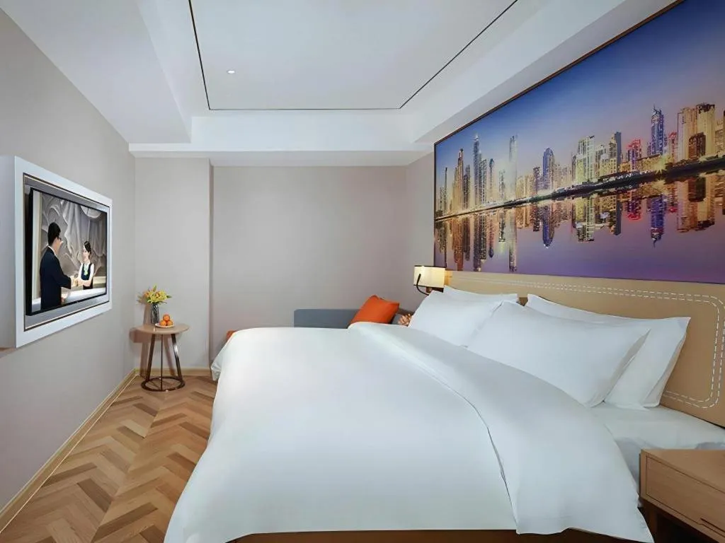 Bed in Vienna Hotel Guangxi Baise Xilin County Juting Cultural Arts Center