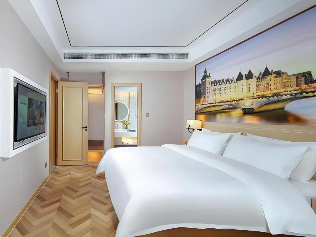 Bed in Vienna Hotel Guangxi Baise Xilin County Juting Cultural Arts Center