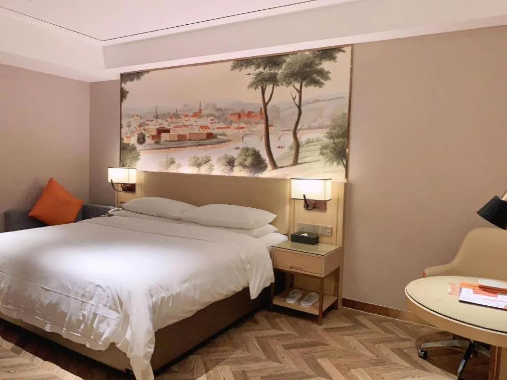 Bed in Vienna Hotel Guangxi Baise Xilin County Juting Cultural Arts Center