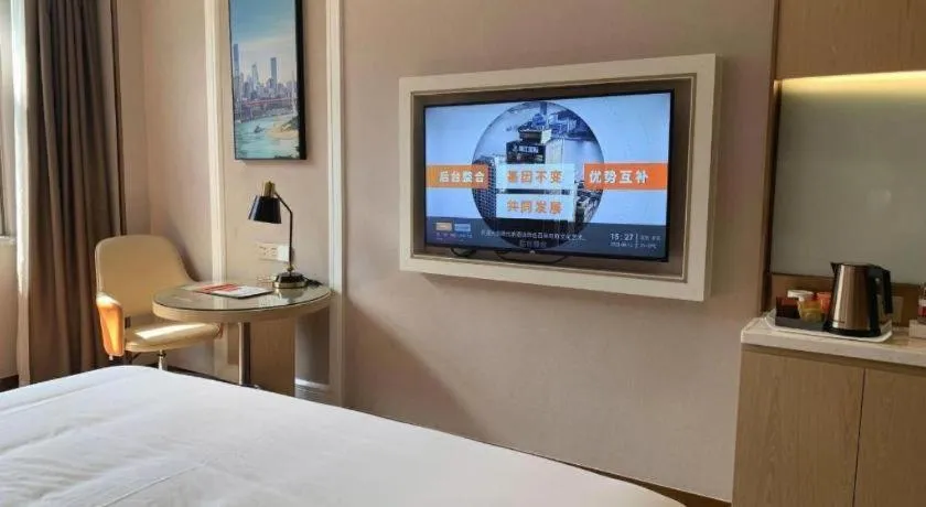 Bed in Vienna Hotel Guangxi Baise Xilin County Juting Cultural Arts Center