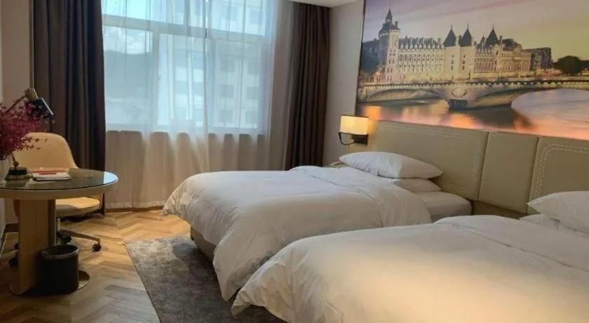 Bed in Vienna Hotel Guangxi Baise Xilin County Juting Cultural Arts Center