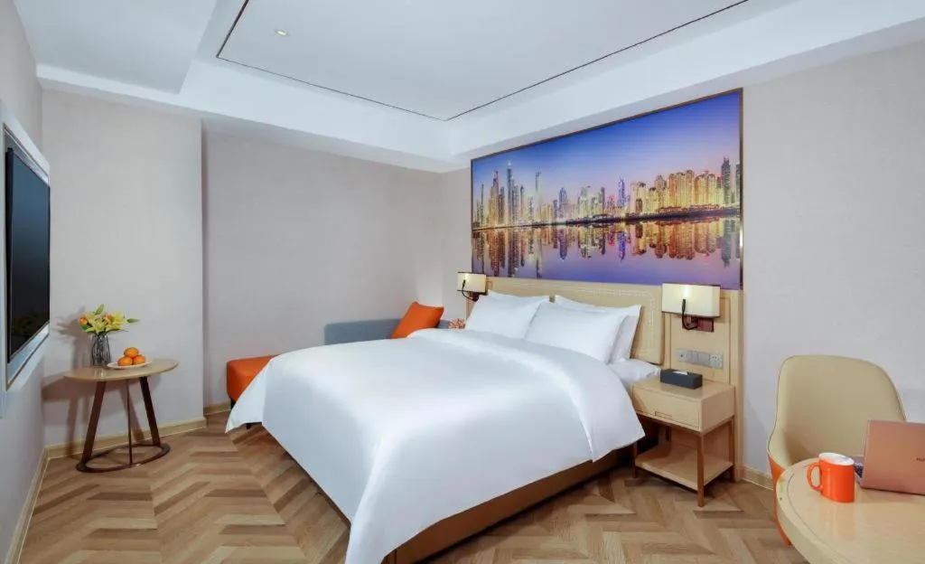 Bed in Vienna Hotel Guangxi Baise Xilin County Juting Cultural Arts Center
