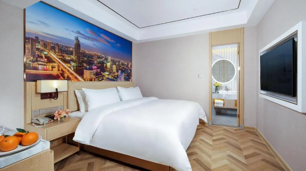 Bed in Vienna Hotel Guangxi Baise Xilin County Juting Cultural Arts Center