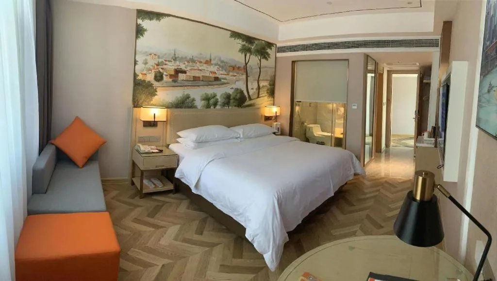 Bed in Vienna Hotel Guangxi Baise Xilin County Juting Cultural Arts Center