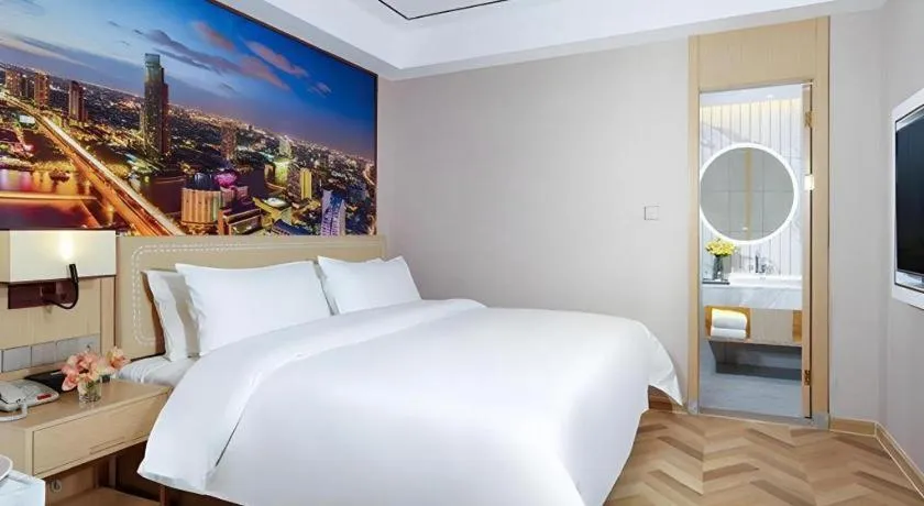 Bed in Vienna Hotel Guangxi Baise Xilin County Juting Cultural Arts Center