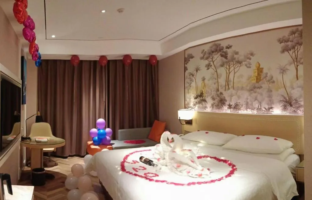 Bed in Vienna Hotel Guangxi Baise Xilin County Juting Cultural Arts Center