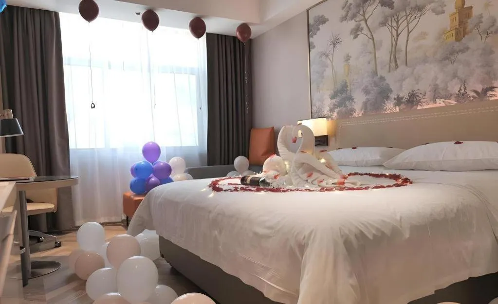 Bed in Vienna Hotel Guangxi Baise Xilin County Juting Cultural Arts Center