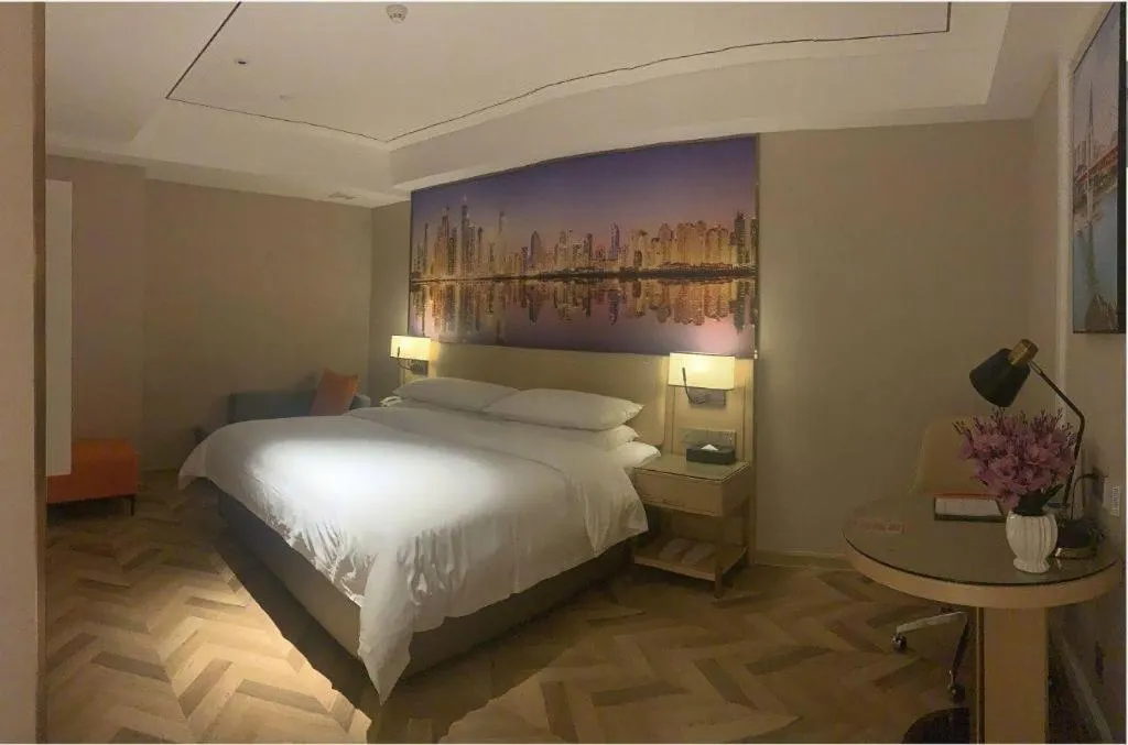 Bed in Vienna Hotel Guangxi Baise Xilin County Juting Cultural Arts Center