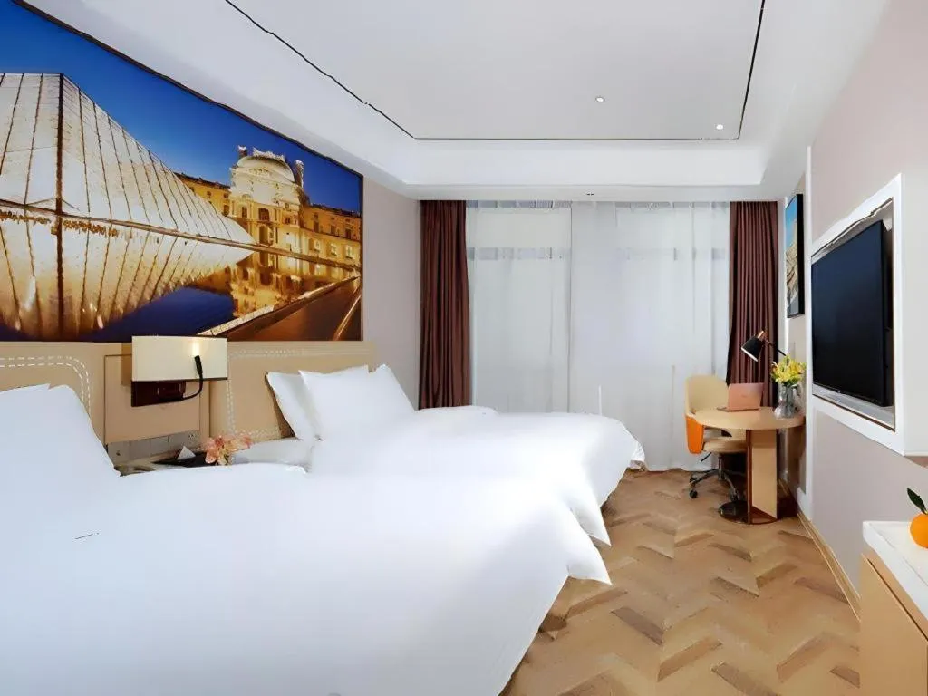 Bed in Vienna Hotel Guangxi Baise Xilin County Juting Cultural Arts Center