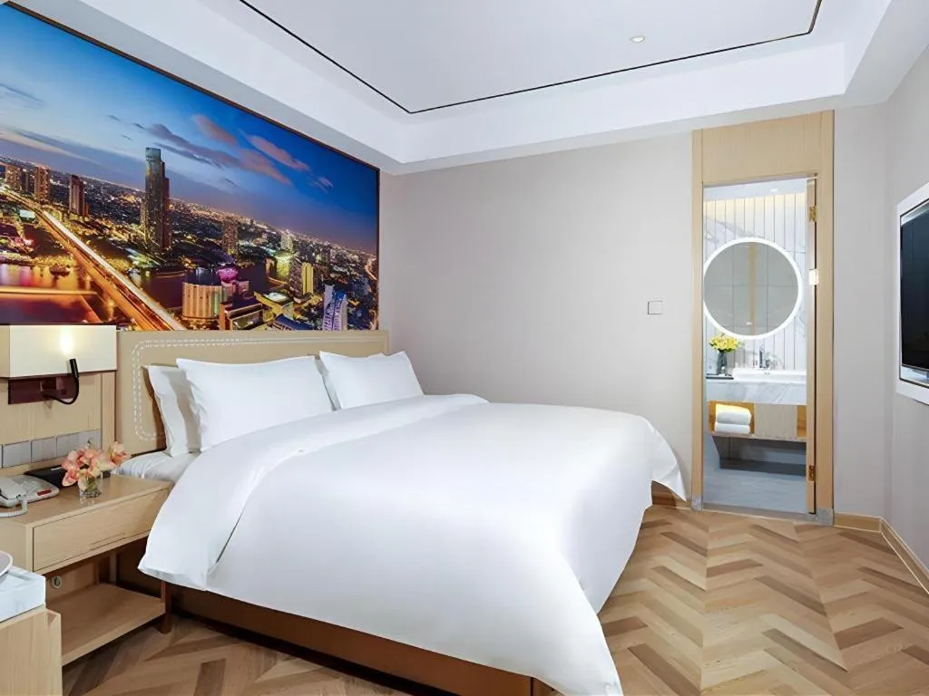 Bed in Vienna Hotel Guangxi Baise Xilin County Juting Cultural Arts Center