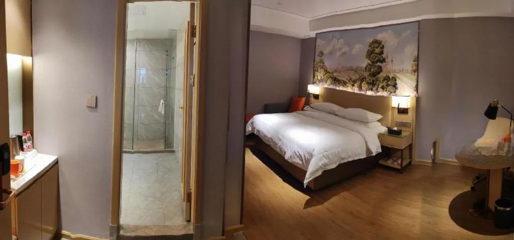 Bed in Vienna Hotel Guangxi Baise Xilin County Juting Cultural Arts Center