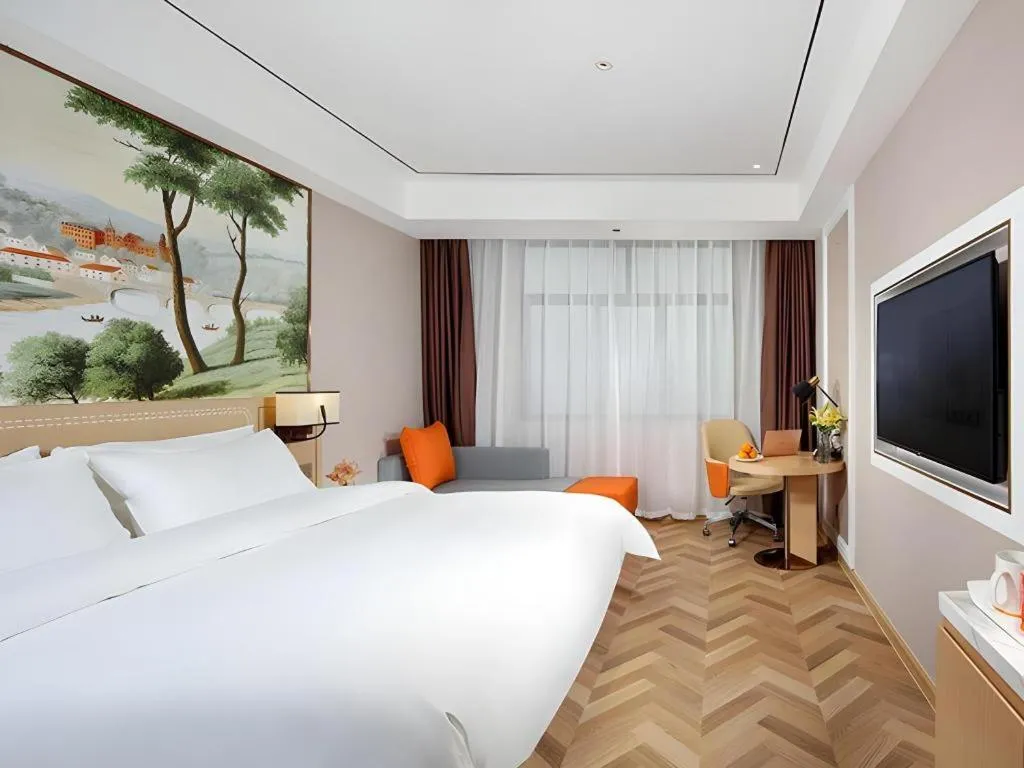 Bed in Vienna Hotel Guangxi Baise Xilin County Juting Cultural Arts Center