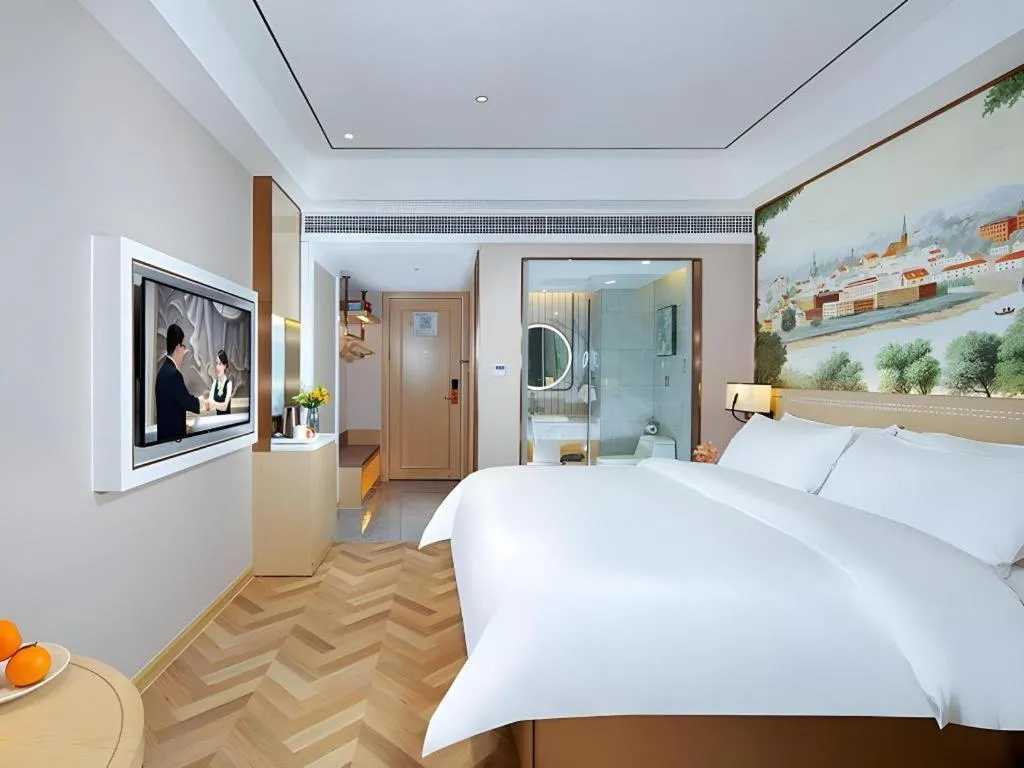 Bed in Vienna Hotel Guangxi Baise Xilin County Juting Cultural Arts Center