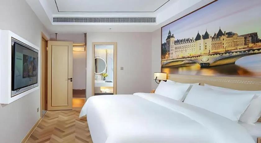 Bed in Vienna Hotel Guangxi Baise Xilin County Juting Cultural Arts Center