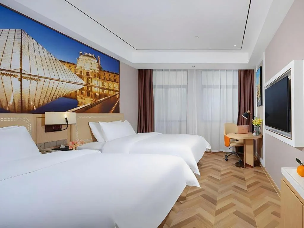 Bed in Vienna Hotel Guangxi Baise Xilin County Juting Cultural Arts Center