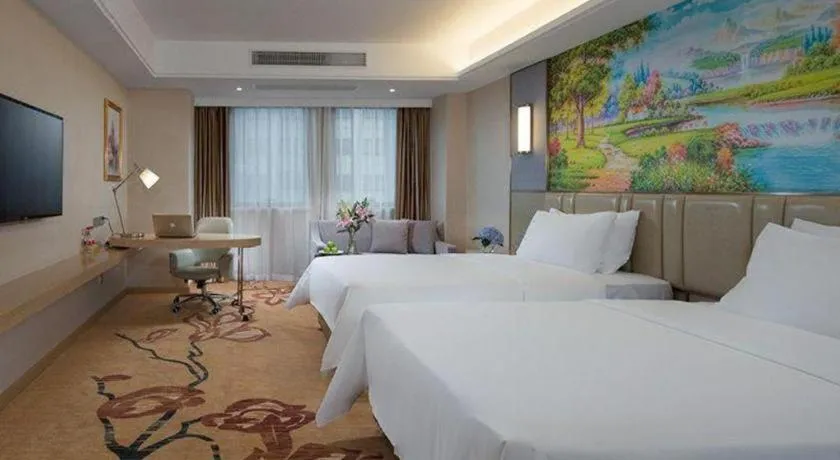 Bed in Vienna Hotel Guangxi Wuzhou High-Tech