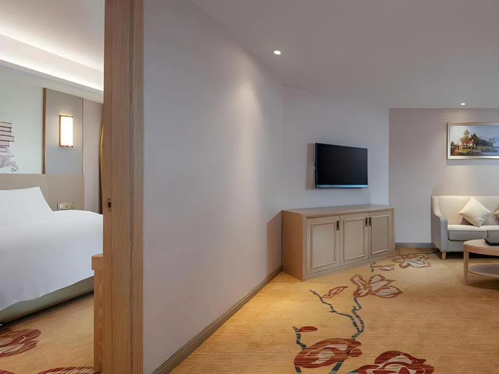 Bed in Vienna Hotel Guangxi Wuzhou High-Tech