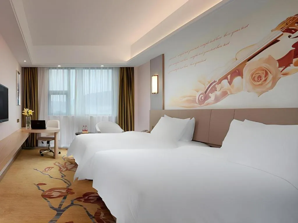 Bed in Vienna Hotel Guangxi Wuzhou High-Tech