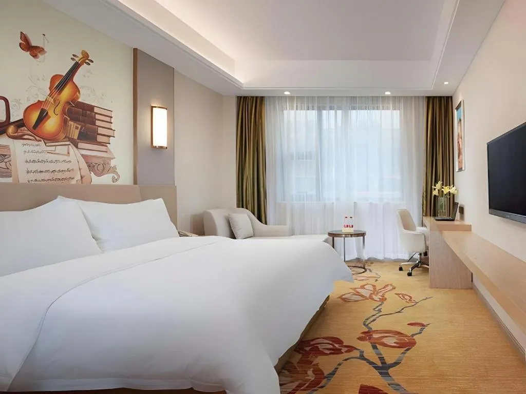 Bed in Vienna Hotel Guangxi Wuzhou High-Tech