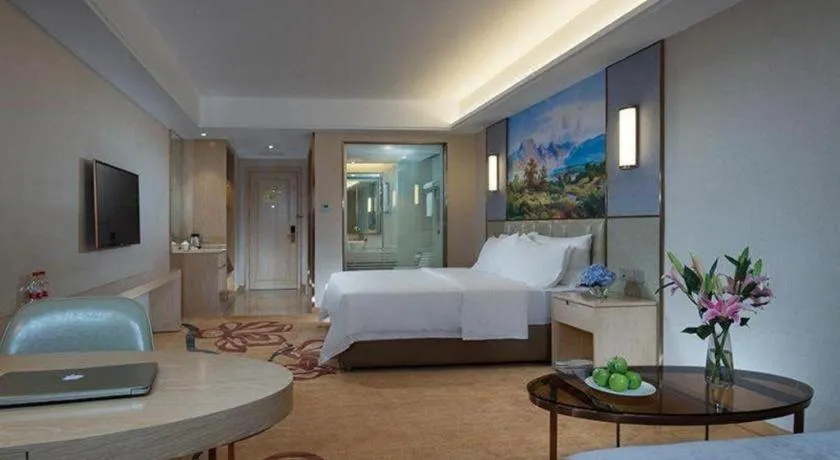 Bed in Vienna Hotel Guangxi Wuzhou High-Tech
