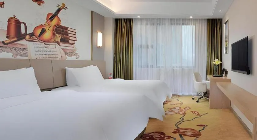 Bed in Vienna Hotel Guangxi Wuzhou High-Tech