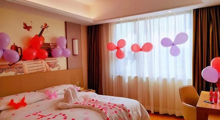 Bed in Vienna Hotel Guangxi Wuzhou High-Tech