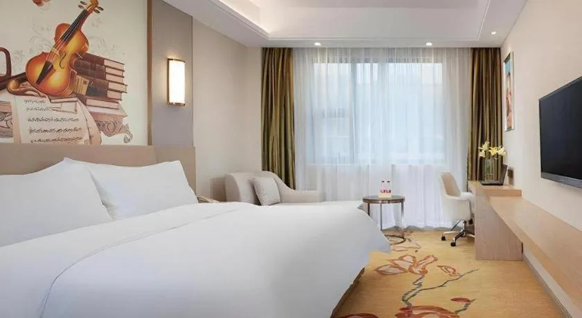 Bed in Vienna Hotel Guangxi Wuzhou High-Tech