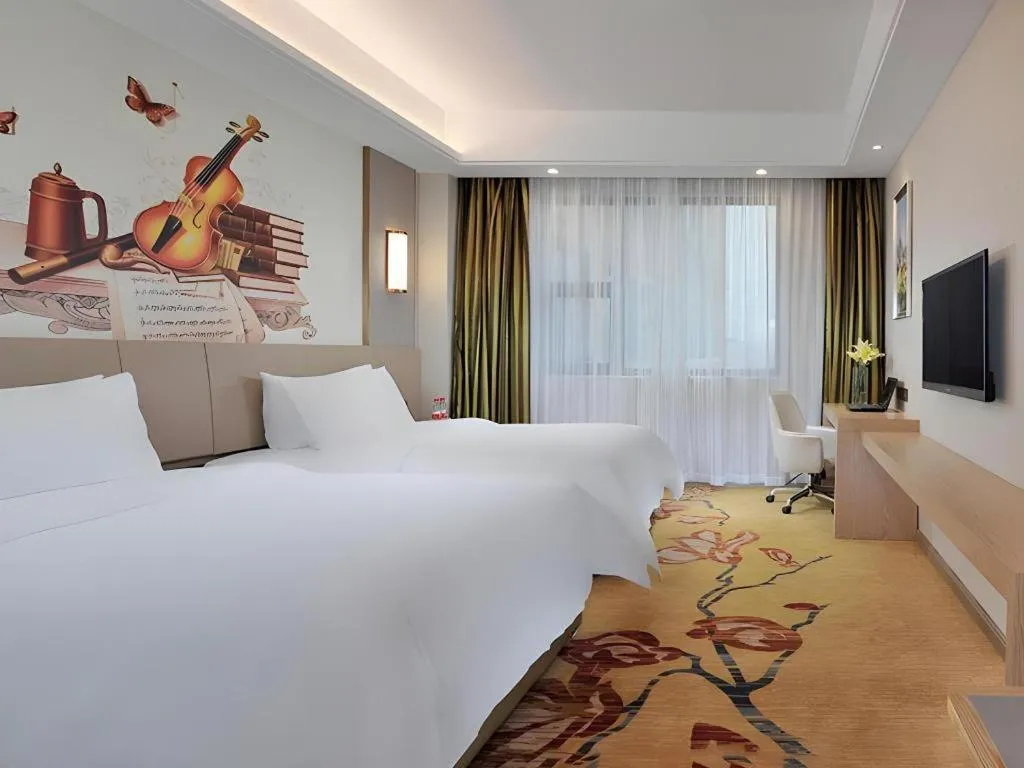 Bed in Vienna Hotel Guangxi Wuzhou High-Tech