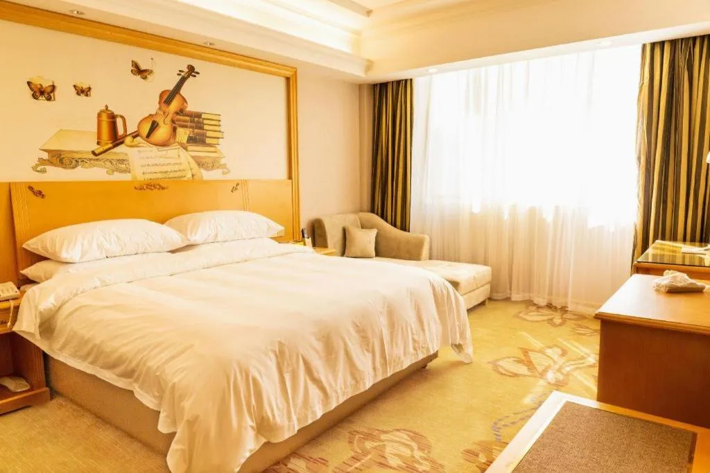 Bed in Vienna Hotel Guangdong Shaoguan Ruyuan Yao Cultural Square