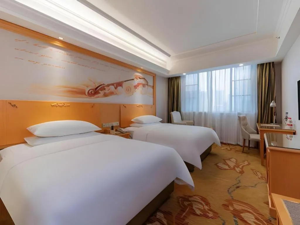 Bed in Vienna Hotel Guangdong Shaoguan Ruyuan Yao Cultural Square