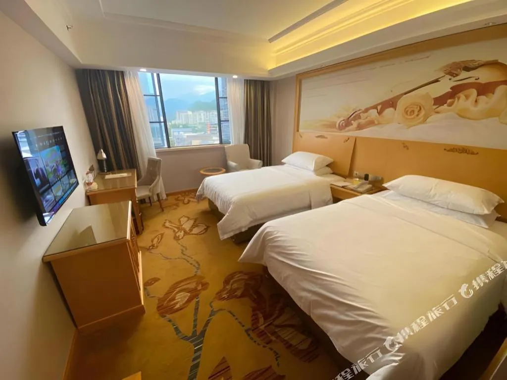 Bed in Vienna Hotel Guangdong Shaoguan Ruyuan Yao Cultural Square