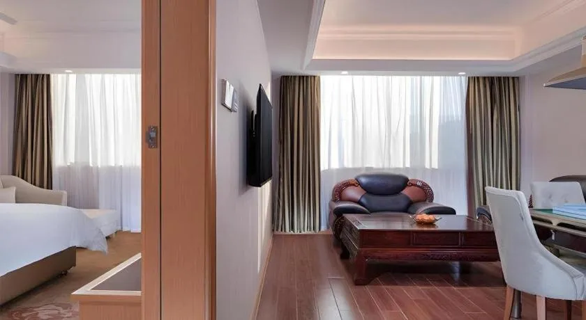 Bed in Vienna Hotel Guangdong Shaoguan Ruyuan Yao Cultural Square