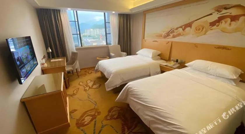 Bed in Vienna Hotel Guangdong Shaoguan Ruyuan Yao Cultural Square