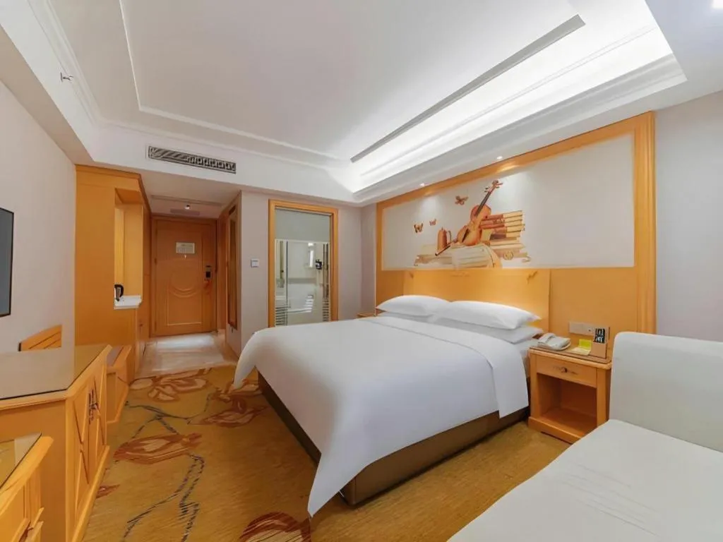 Bed in Vienna Hotel Guangdong Shaoguan Ruyuan Yao Cultural Square