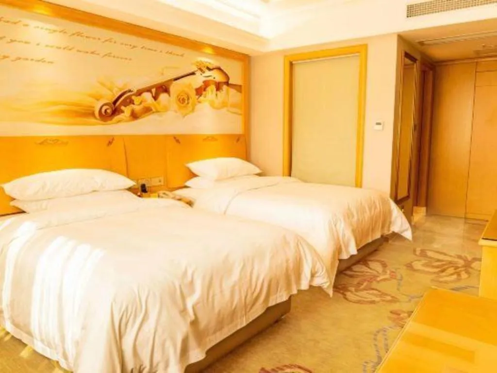 Bed in Vienna Hotel Guangdong Shaoguan Ruyuan Yao Cultural Square