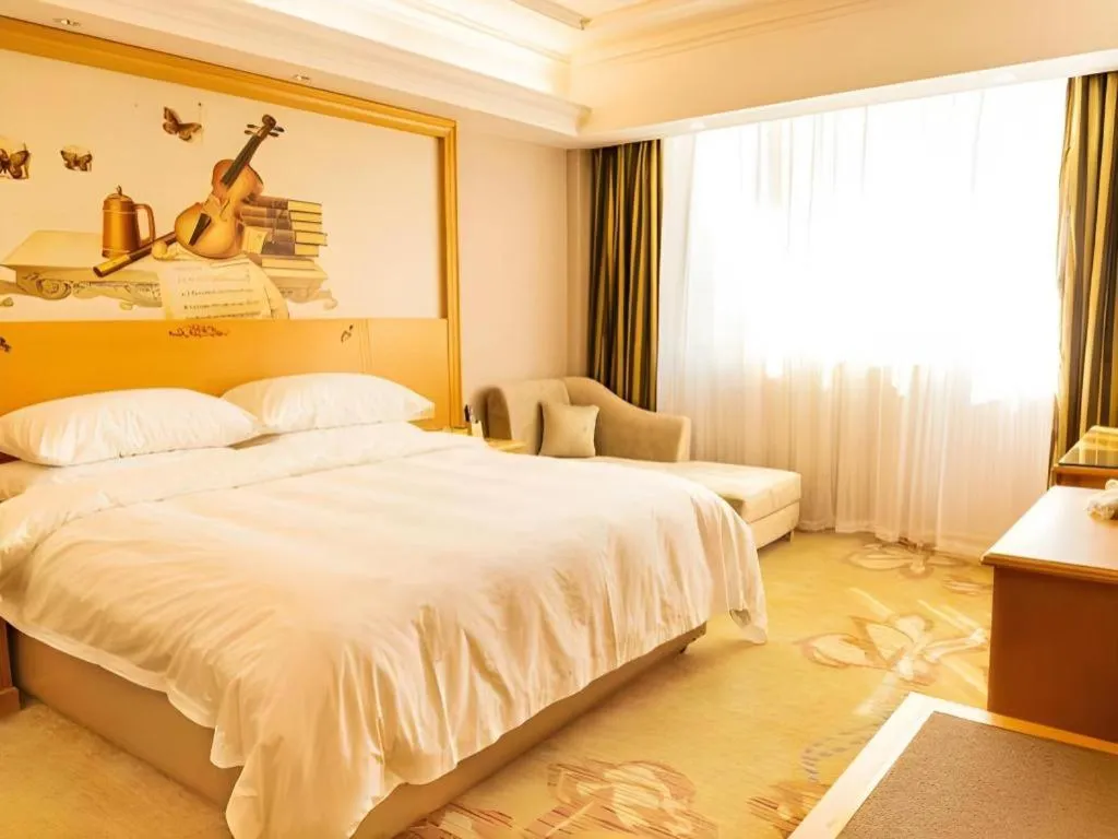 Bed in Vienna Hotel Guangdong Shaoguan Ruyuan Yao Cultural Square