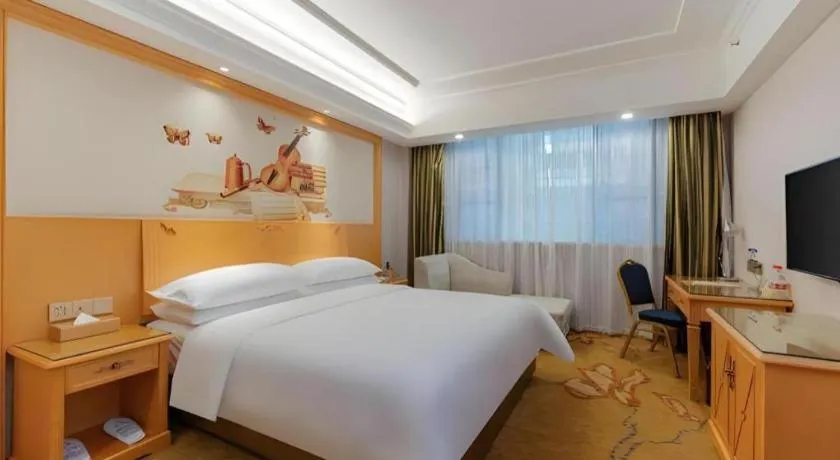 Bed in Vienna Hotel Guangdong Shaoguan Ruyuan Yao Cultural Square